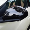 Glossy black carbon fiber texture side mirror cover for BYD vehicles.