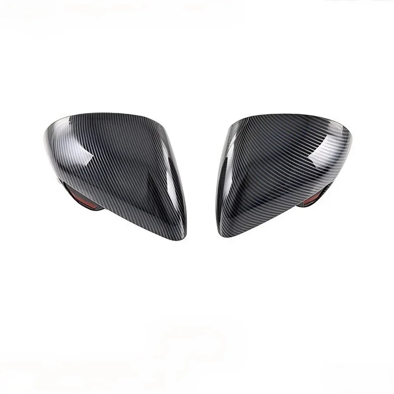 Pair of glossy black carbon fiber side mirror covers for BYD cars.