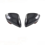 Pair of glossy black carbon fiber side mirror covers for BYD cars.