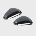 Glossy black carbon fiber side mirror covers for BYD vehicles.