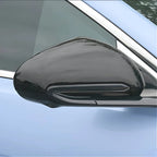 Glossy black aftermarket side mirror cover for BYD vehicles.