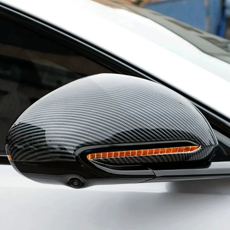 Carbon fiber texture black side mirror cover for BYD, featuring a sleek glossy finish.