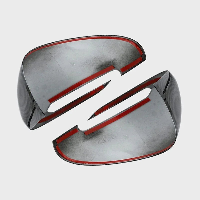 Carbon fiber texture side mirror covers with striking red trim accents.