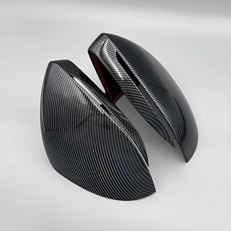 Pair of sleek black carbon fiber textured side mirror covers for BYD vehicle protection.