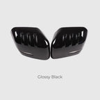 Glossy black side mirror covers with a sleek, aerodynamic ribbed design.