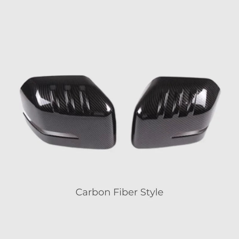 Glossy black carbon fiber style side mirror covers for BYD aftermarket protection.