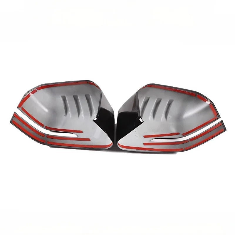 Pair of silver and black car mirror covers with distinctive red accent lines