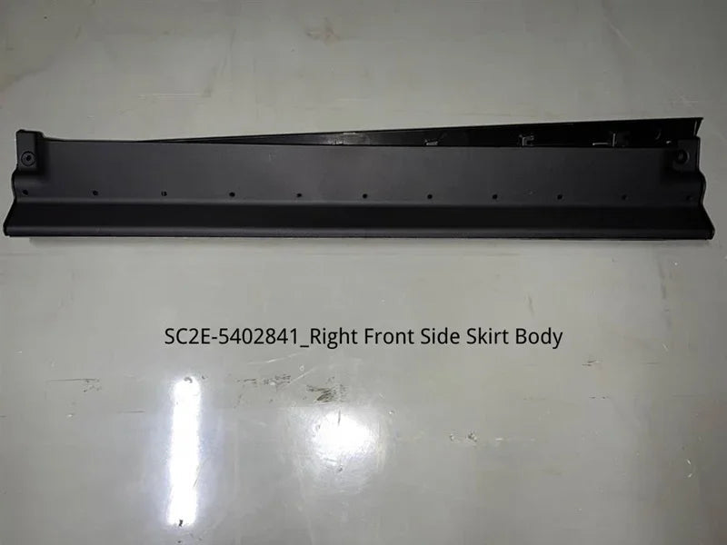 Matte black right front side skirt body panel made of durable composite material.