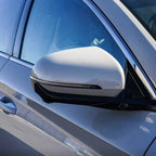 Sleek silver metallic mirror cover for BYD vehicle with integrated LED indicator