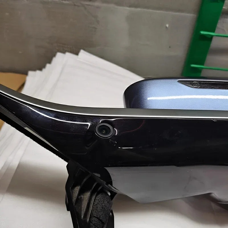 Close-up of a glossy black car accessory part with a precision-fit mounting hole.