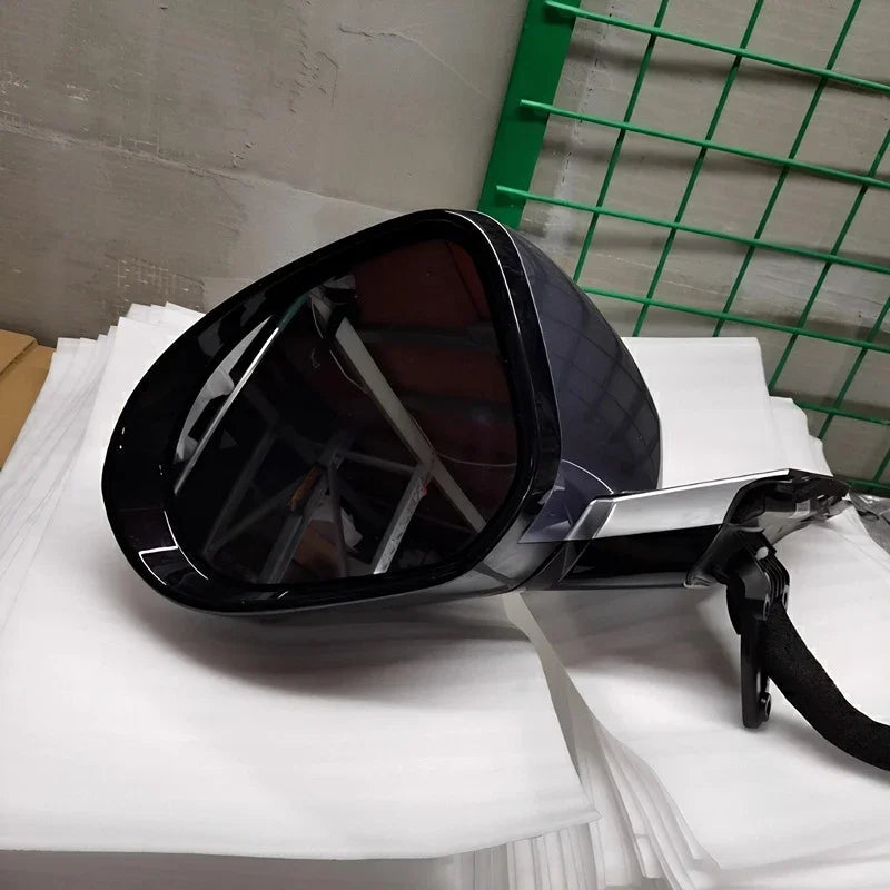 Glossy black side mirror housing for BYD vehicle with a sleek, aerodynamic design.