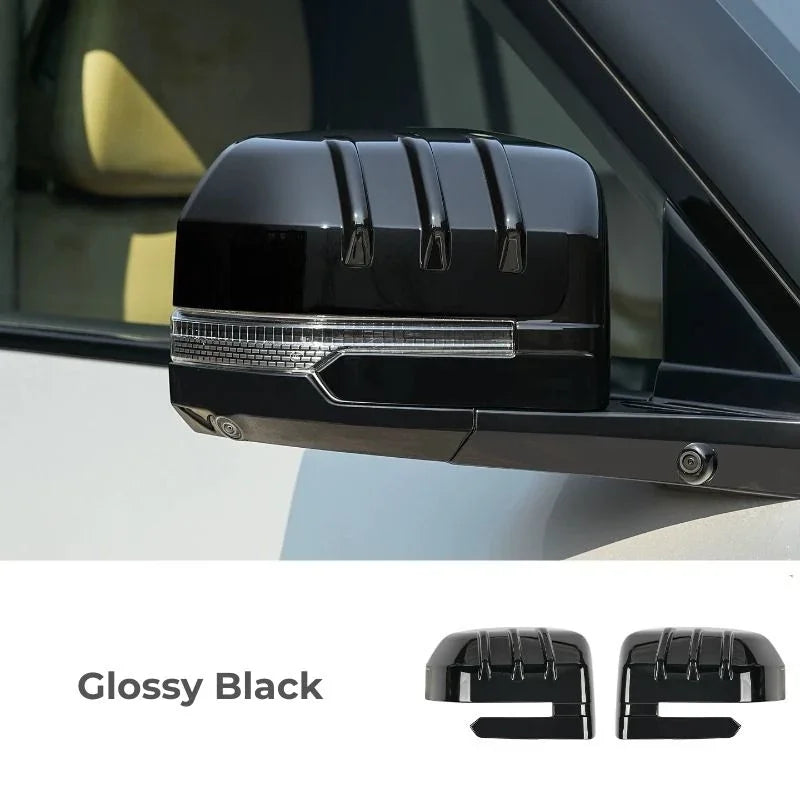 Glossy black side mirror covers with a sleek, streamlined design for BYD vehicles.