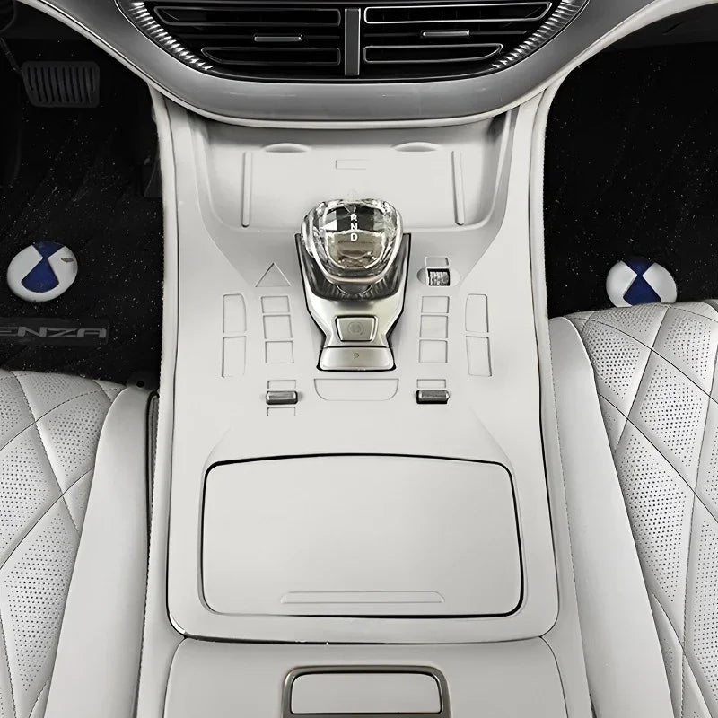 White leather center console with diamond-stitched accents and crystal gear shifter.