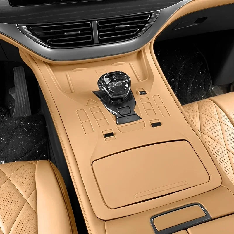 Tan leather center console and gear shifter with diamond stitching for BYD interior.