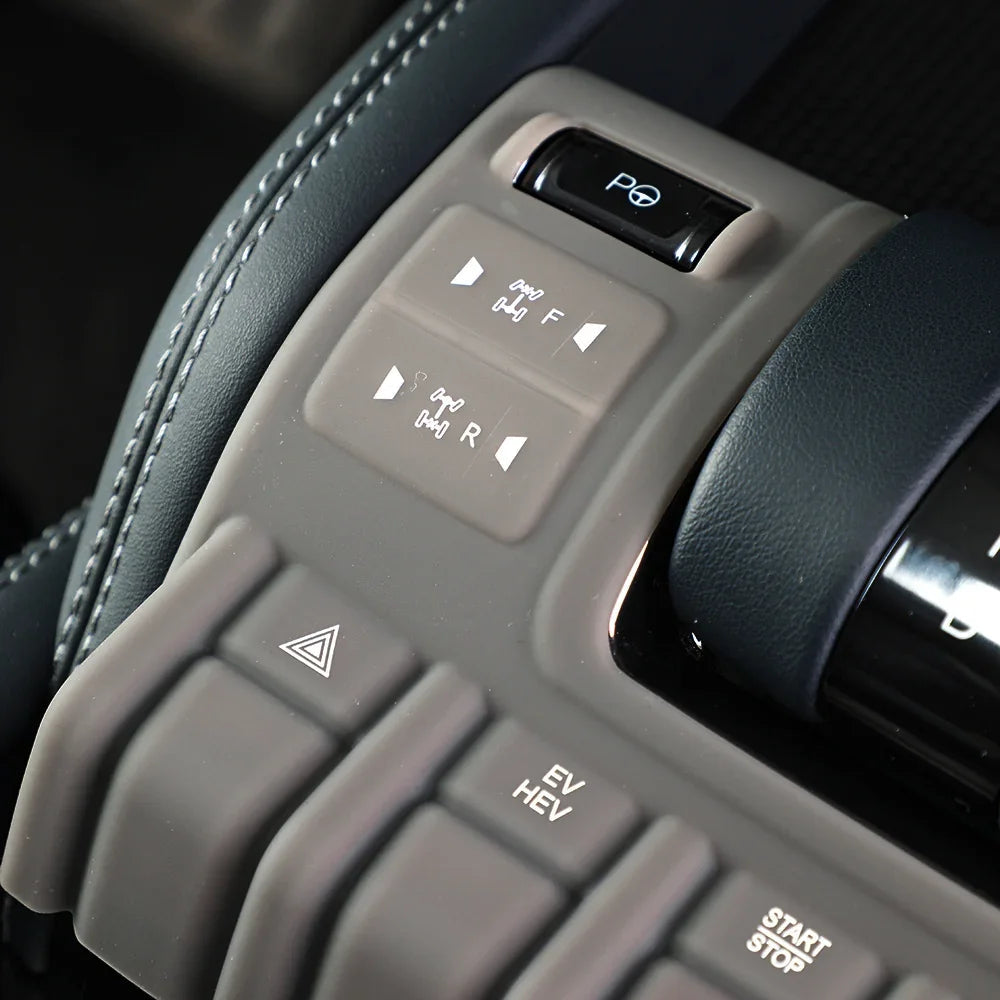 Close-up of grey matte silicone center console buttons for BYD, featuring professional texture.