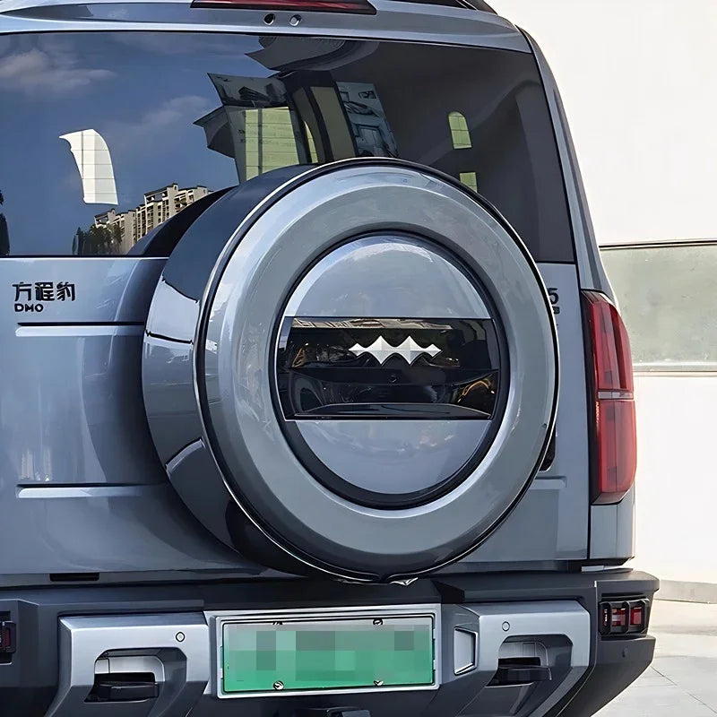 Grey hard-shell spare tire cover with a sleek integrated window design for BYD vehicles.