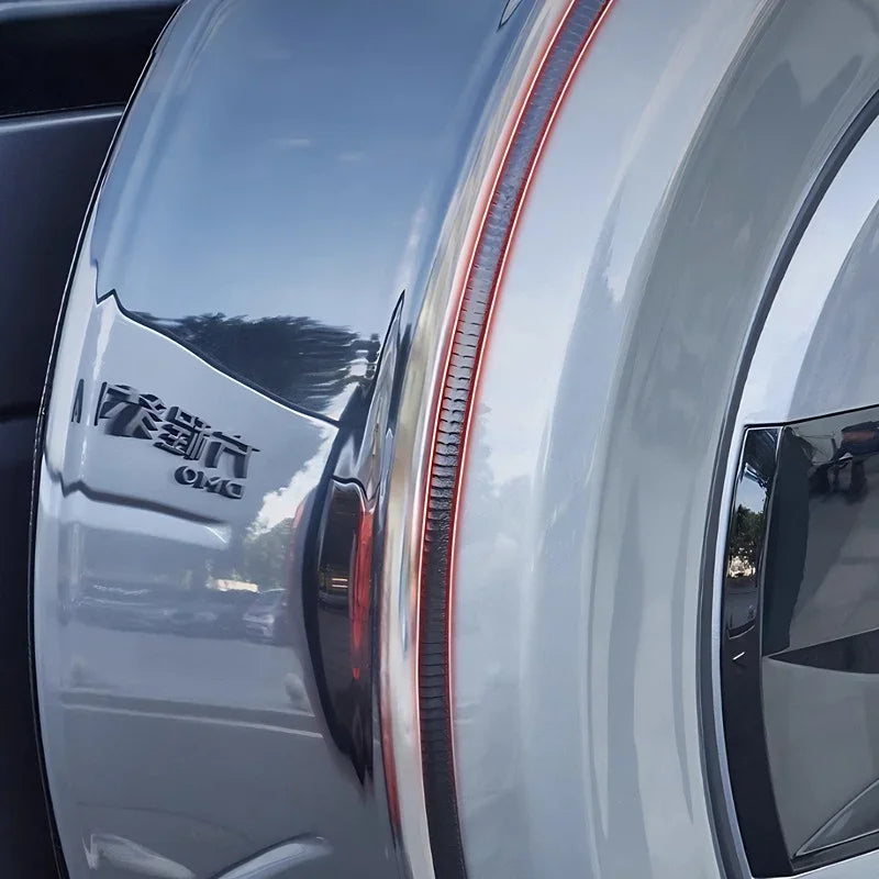 Sleek silver metallic car exterior featuring a vertical red LED taillight strip.