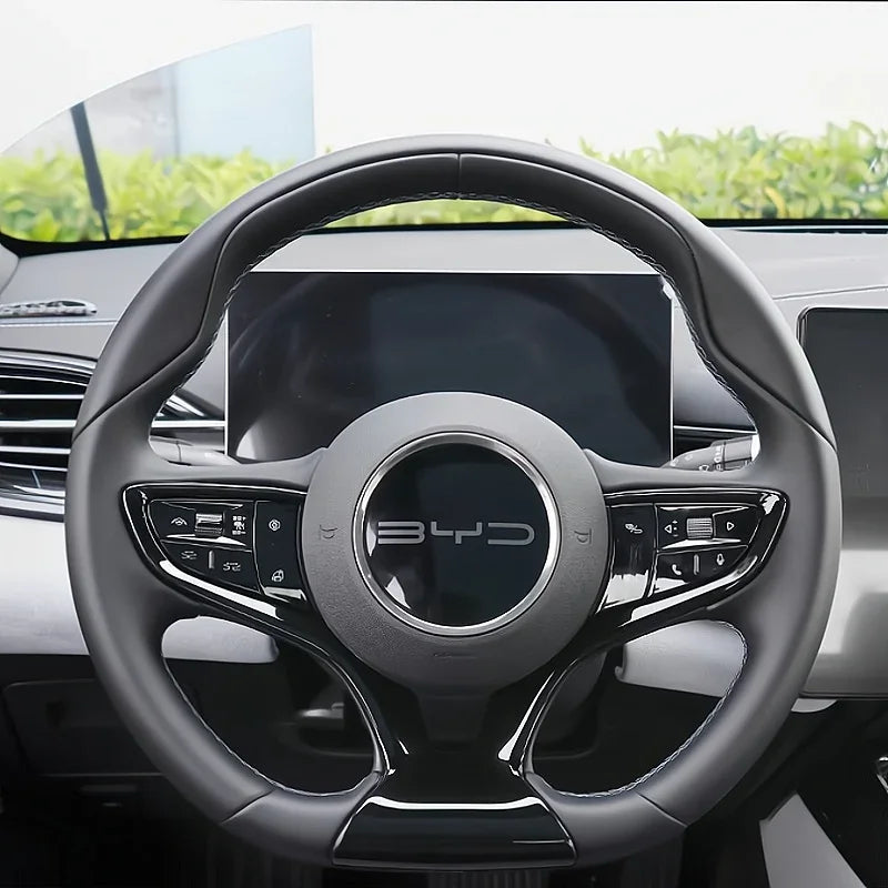 Black leather-wrapped steering wheel with silver accents and BYD logo for premium car interior.