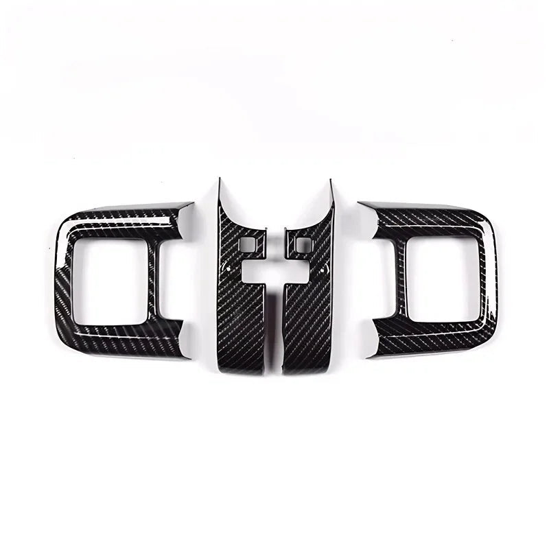 Black carbon fiber interior trim kit for BYD center console and side panels.