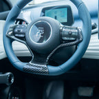 Blue leather steering wheel with carbon fiber accents for BYD vehicle interior