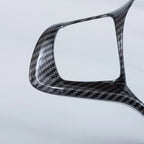Professional carbon fiber automotive trim piece with a glossy black weave finish