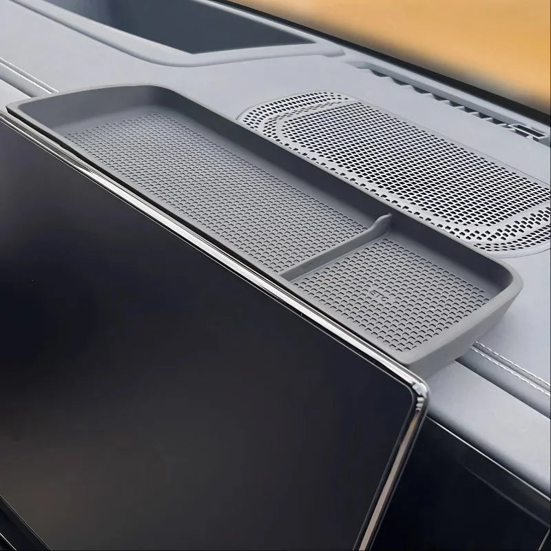 Gray silicone car center console organizer tray with non-slip textured surface.