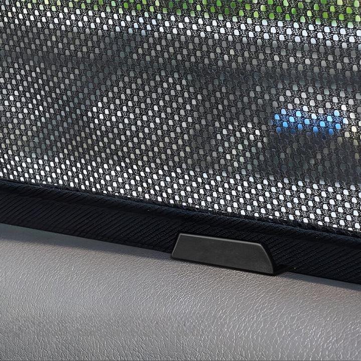 Close-up of a black mesh car sunshade with a durable fabric border and mounting clip.