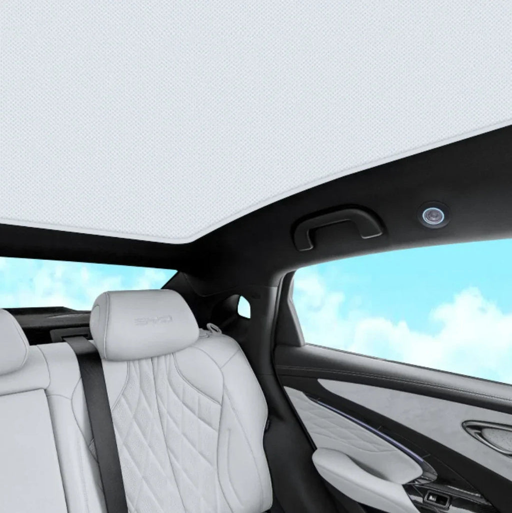 White quilted leather car seat interior with premium textured upholstery and sleek black trim.