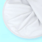 Close-up view of durable white fabric material with smooth folds and clean edges.