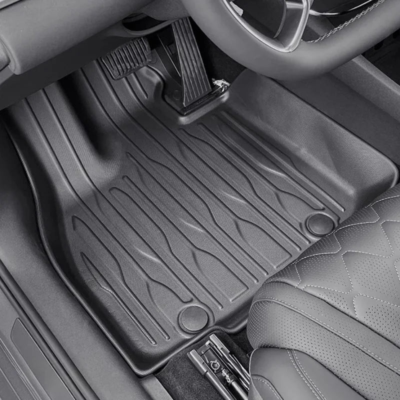 Black heavy-duty TPE waterproof floor mats with textured anti-slip surface for car interior protection.