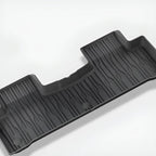 Durable black TPE custom-fit car floor mat with textured anti-slip surface.