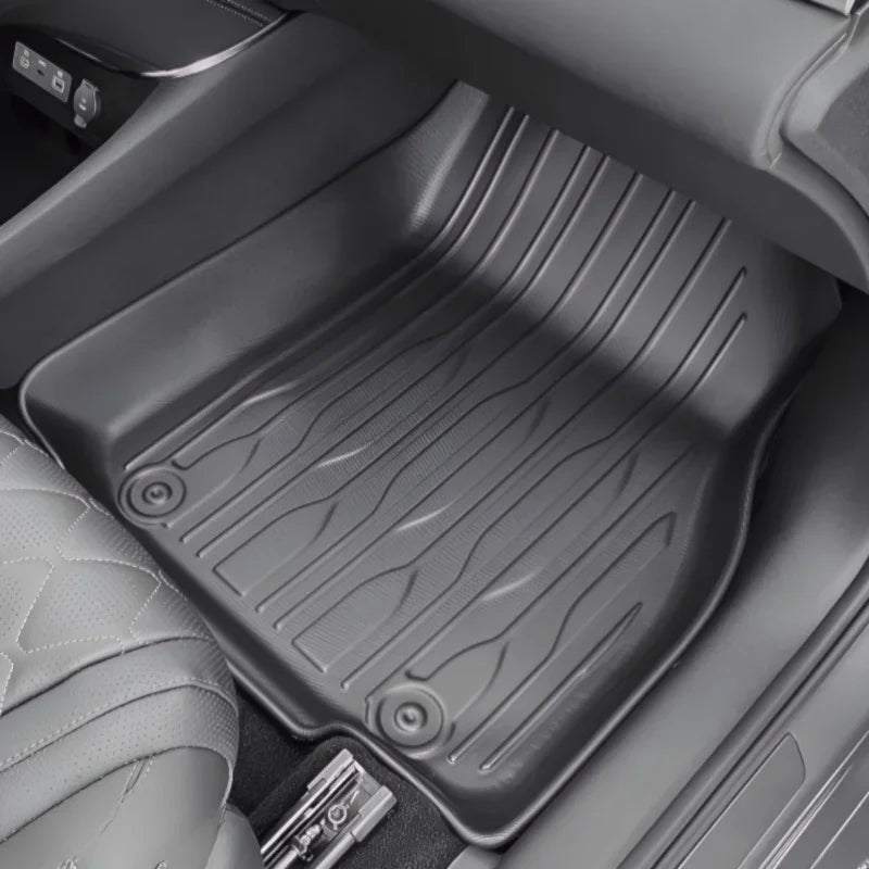 Black custom-fit all-weather rubber car floor mat with deep grooves for maximum protection.