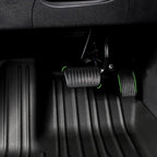 Black rubber floor mats with custom green trim accents for BYD vehicle protection.