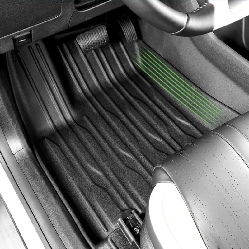 Black heavy-duty TPE waterproof floor mats with anti-slip grooves for BYD vehicle protection.