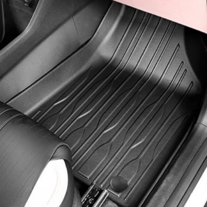 Black heavy-duty TPE rubber floor mats with anti-slip textured grooves for car protection.