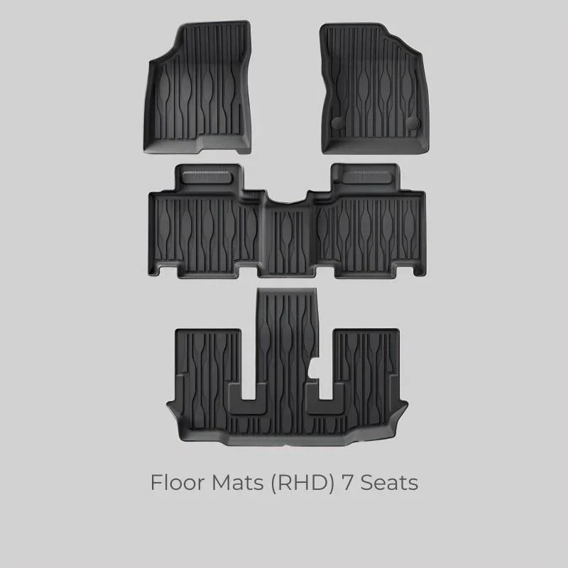Set of 7 black heavy-duty rubber floor mats for RHD vehicles, featuring a durable textured design.