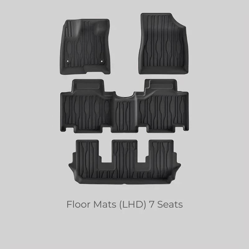 Set of black heavy-duty rubber floor mats for a 7-seat LHD vehicle.