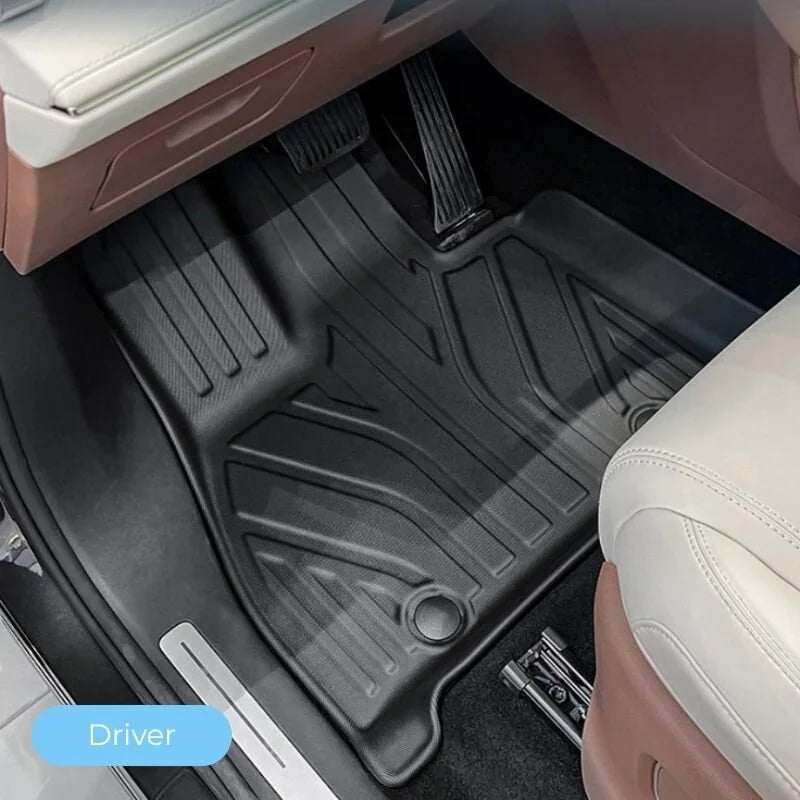 Custom-fit black TPE rubber car floor mat for driver side with anti-slip textured surface.