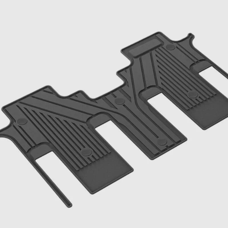 Professional black rubber custom-fit car floor mats with anti-slip textured patterns.