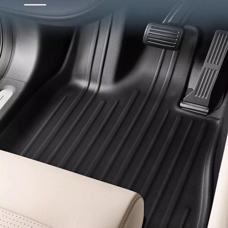 Black textured TPE floor mats for BYD, featuring a durable anti-slip ribbed design.