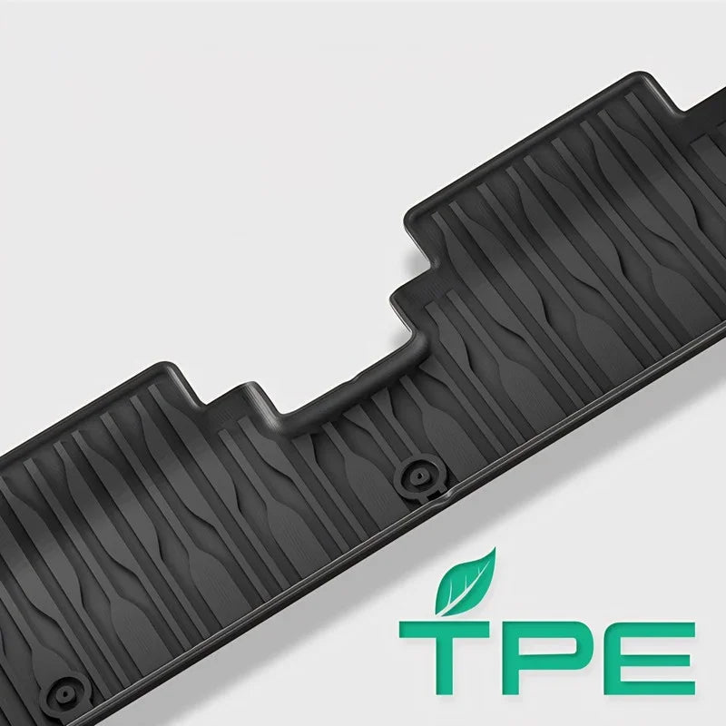 Black textured TPE car floor mat with anti-slip grooves for durable vehicle protection.