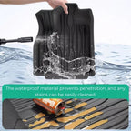 Black waterproof TPE car floor mat with anti-slip grooves protecting against liquid spills.