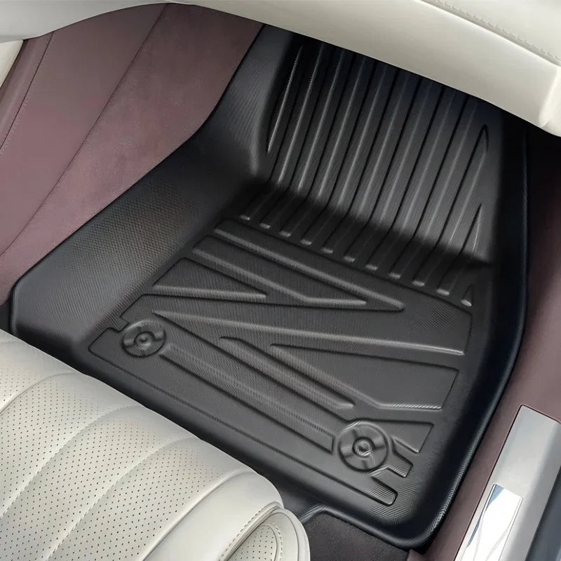 Custom-fit black TPE floor mats with a textured anti-slip surface for BYD car protection.