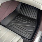 Custom-fit black TPE floor mats with a textured anti-slip surface for BYD car protection.