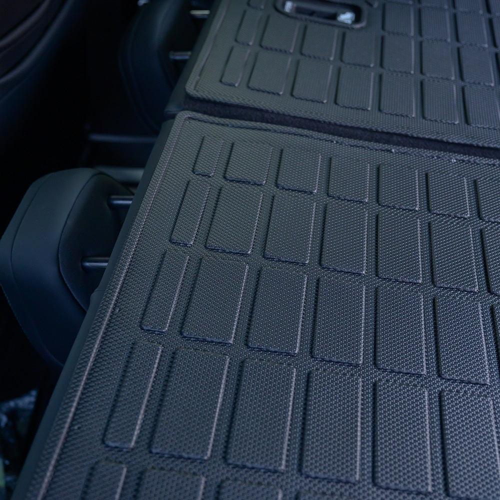 Black textured TPE waterproof trunk mat with anti-slip grid design for BYD car protection.