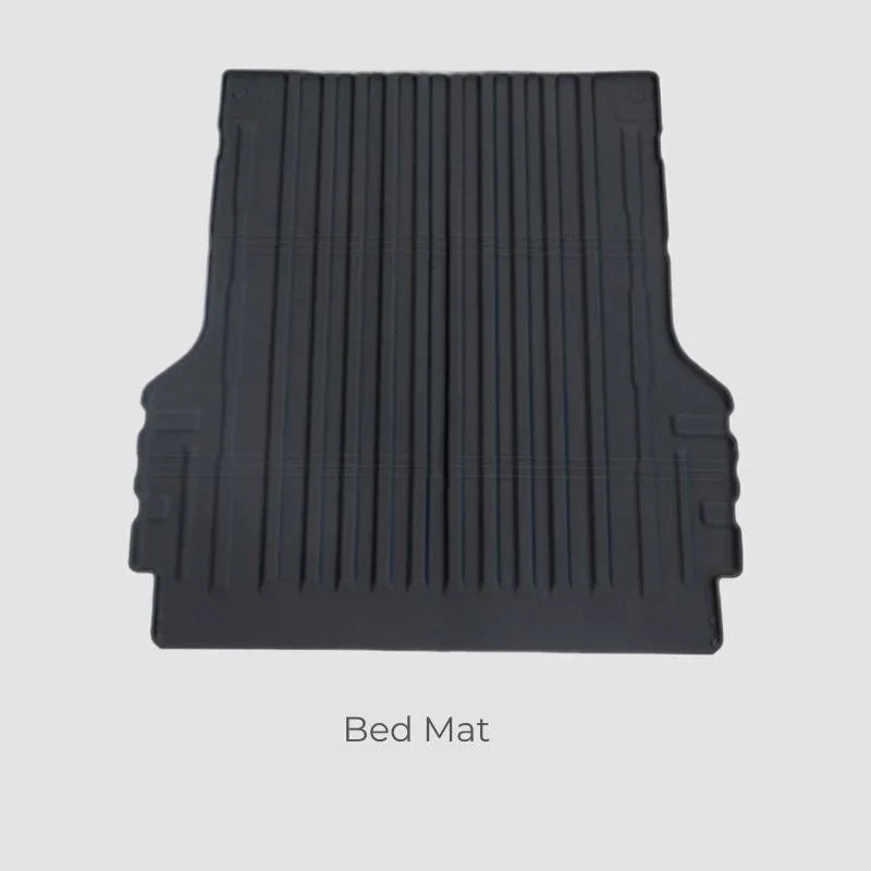 Durable black rubberized bed mat with deep anti-slip grooves for heavy-duty cargo protection.