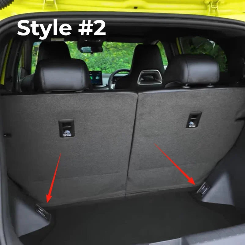 Interior view of a car featuring a charcoal grey fabric rear seat back protector.