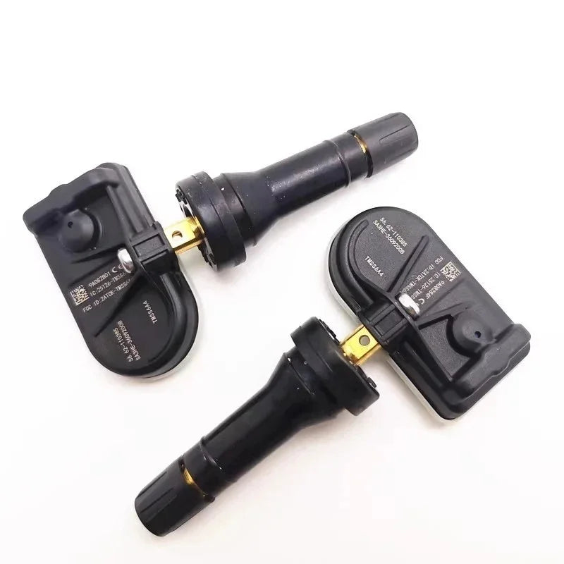 Pair of black TPMS tire pressure sensor valves with gold-toned metal connectors.