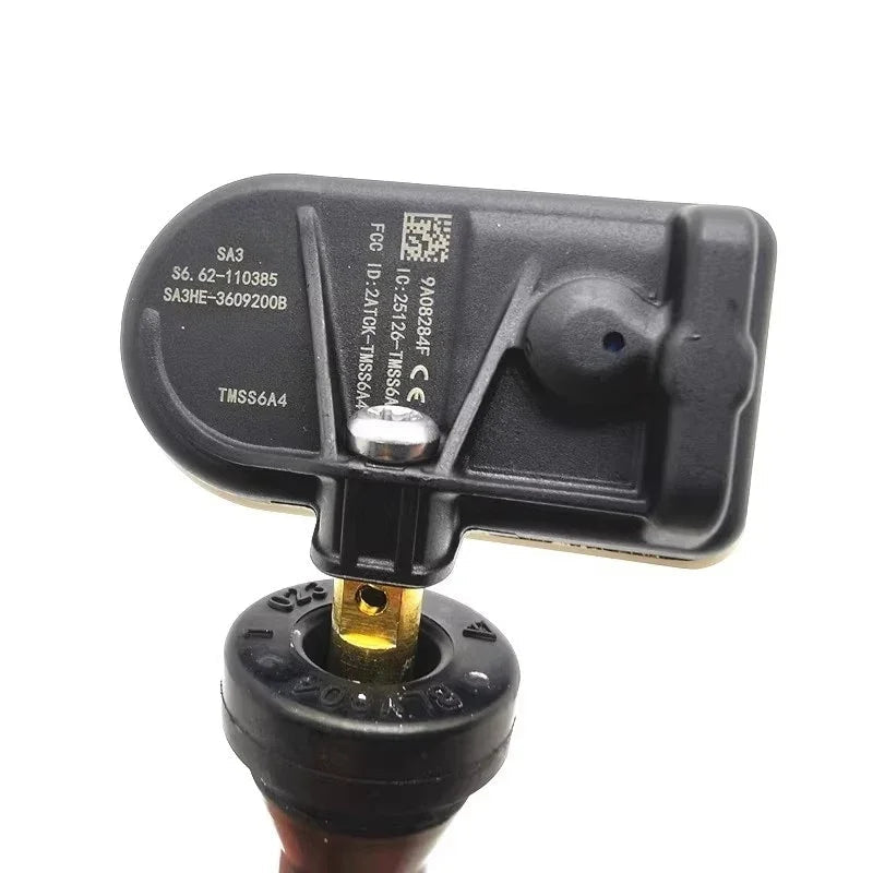 Black plastic BYD smart key remote with metallic gold-tone buttons and technical serial markings.