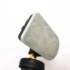 White durable plastic protective cap with black rubber base for automotive parts.